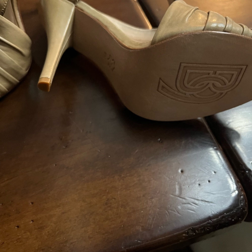 Tan leather open toe heals.